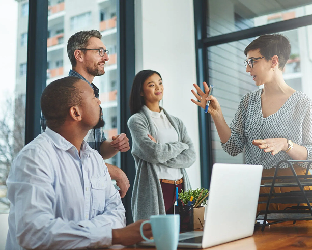 Business team in office discussing ideas during a collaborative meeting